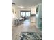 Open-concept dining area with white table set and easy access to kitchen and living space at 599 Carmel Rd, Venice, FL 34293