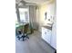 Bright office space with modern flooring, white cabinets, and a colorful desk at 599 Carmel Rd, Venice, FL 34293