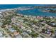 Expansive aerial view showcasing a residential area with waterways and lush greenery at 601 Apalachicola Rd, Venice, FL 34285