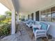 Inviting front porch with comfortable seating and stylish decor at 601 Apalachicola Rd, Venice, FL 34285