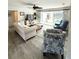 Inviting living room featuring hardwood floors, a ceiling fan and comfortable seating at 601 Apalachicola Rd, Venice, FL 34285