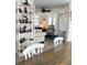 Bright living room featuring white shelves, a ceiling fan, and comfortable seating at 601 Apalachicola Rd, Venice, FL 34285