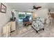 Bright living area with comfortable seating and views of the pool area at 601 Apalachicola Rd, Venice, FL 34285