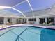 Sparkling pool area with ample seating for relaxation and entertaining at 601 Apalachicola Rd, Venice, FL 34285