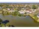 Aerial view of waterfront home featuring screened in pool at 6146 Rockefeller Ave, Sarasota, FL 34231