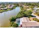 Beautiful waterfront home featuring a screened in pool at 6146 Rockefeller Ave, Sarasota, FL 34231