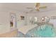 Comfortable bedroom with a ceiling fan and modern decor at 6146 Rockefeller Ave, Sarasota, FL 34231