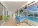 Enclosed Florida room featuring tile floors and views of the pool at 6146 Rockefeller Ave, Sarasota, FL 34231