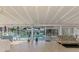 Bright Florida room with tile flooring and view of outdoor swimming pool at 6146 Rockefeller Ave, Sarasota, FL 34231