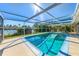 Relaxing screened-in pool features beautiful waterfront views at 6146 Rockefeller Ave, Sarasota, FL 34231