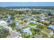 Neighborhood aerial highlighting mature trees, diverse home styles, and street views at 6216 Pecan Rd, Venice, FL 34293