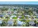 Aerial view of neighborhood featuring a mix of home styles and mature trees at 6216 Pecan Rd, Venice, FL 34293