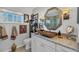 Elegant bathroom showcasing a decorative mirror, vessel sink, and white vanity at 6216 Pecan Rd, Venice, FL 34293