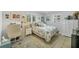 Bright bedroom with multiple windows, neutral decor, and ample natural light at 6216 Pecan Rd, Venice, FL 34293