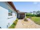 Inviting entrance to a cozy home with a screened in porch at 647 Linden Dr, Englewood, FL 34223