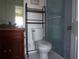Bathroom featuring a vanity, toilet, shelving unit, and shower with glass doors at 649 S Tamiami S Trl # 304, Venice, FL 34285