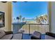 Relaxing balcony view showcasing beach, pool, palms, and beautiful skyline at 700 Golden Beach Blvd # 224, Venice, FL 34285