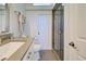 Elegant bathroom featuring modern fixtures, vanity, and a glass-enclosed shower at 700 Golden Beach Blvd # 224, Venice, FL 34285