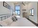 Bright bedroom featuring high ceilings, a view, and black window frames at 700 Golden Beach Blvd # 224, Venice, FL 34285