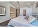 Comfortable bedroom with high ceiling, wood floors, and a railing at 700 Golden Beach Blvd # 224, Venice, FL 34285