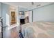 Bedroom featuring a bed with a patterned comforter, TV, and access to an ensuite bathroom and dining area at 700 Golden Beach Blvd # 224, Venice, FL 34285