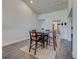 Bright open-concept dining area features wood-look flooring and neutral colors at 700 Golden Beach Blvd # 224, Venice, FL 34285