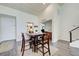 Open-concept dining area features wood-look flooring and kitchen view at 700 Golden Beach Blvd # 224, Venice, FL 34285