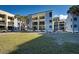 Rear exterior of condo building shows multiple balconies for outdoor seating at 700 Golden Beach Blvd # 224, Venice, FL 34285