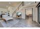 Open living area with staircase, view to bedroom, living area, and dining room at 700 Golden Beach Blvd # 224, Venice, FL 34285