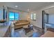 Bright living room featuring large windows with ocean views and comfortable, stylish seating at 700 Golden Beach Blvd # 224, Venice, FL 34285