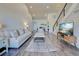 Cozy living room featuring wood floors, stairs, media center, and bright open space at 700 Golden Beach Blvd # 224, Venice, FL 34285