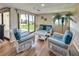 Cozy sitting area features comfortable wicker furniture and a view of the outdoors at 700 Golden Beach Blvd # 224, Venice, FL 34285