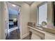 Bright vanity area featuring a built-in makeup counter, a window, and natural lighting at 700 Golden Beach Blvd # 224, Venice, FL 34285