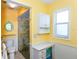 Bright bathroom featuring a walk-in shower, toilet, and tiled floor at 72 Circlewood Dr # A2-7, Venice, FL 34293