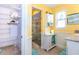 Bathroom with a stone tiled shower, vanity, and coastal decor at 72 Circlewood Dr # A2-7, Venice, FL 34293