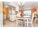 Bright dining area with ceiling fan and natural light flowing through the windows at 72 Circlewood Dr # A2-7, Venice, FL 34293