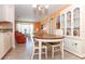 Charming dining space featuring a wood-top table, tile floors, and easy access to living room at 72 Circlewood Dr # A2-7, Venice, FL 34293