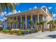 Modern building featuring a symmetrical facade, large arched windows, and stately columns at 72 Circlewood Dr # A2-7, Venice, FL 34293