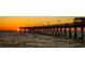 Sunset view of the Venice Fishing Pier with the sun setting on the horizon at 72 Circlewood Dr # A2-7, Venice, FL 34293