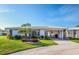 Charming single-story home featuring well-maintained landscaping, tile roof and an inviting front entrance at 72 Circlewood Dr # A2-7, Venice, FL 34293