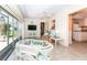 Florida room featuring lots of windows and a tile floor overlooking the outdoor patio at 72 Circlewood Dr # A2-7, Venice, FL 34293
