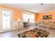 Bright living room boasting tiled floors, natural light, and front door at 72 Circlewood Dr # A2-7, Venice, FL 34293