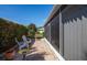 Relaxing screened patio with tile flooring, comfortable seating, and lush landscaping at 72 Circlewood Dr # A2-7, Venice, FL 34293