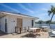 Dine outdoors on the patio with views of the lake and lush surroundings, perfect for relaxing and enjoying the scenery at 72 Circlewood Dr # A2-7, Venice, FL 34293