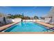 Relax in this pristine community pool with lounge chairs, clear water, and well-maintained surroundings at 72 Circlewood Dr # A2-7, Venice, FL 34293