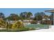 Community shuffleboard courts surrounded by greenery and landscaping at 72 Circlewood Dr # A2-7, Venice, FL 34293