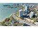Aerial view of the building, bay, and city skyline, showcasing the surrounding neighborhood at 770 S Palm Ave # 404, Sarasota, FL 34236