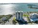 Stunning aerial view of waterfront condo with bay views and city skyline at 770 S Palm Ave # 404, Sarasota, FL 34236