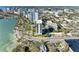 Aerial view showing the building's proximity to the water, city, and nearby road at 770 S Palm Ave # 404, Sarasota, FL 34236