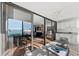 Spacious balcony features a seating area and sliding glass doors, merging the indoor and outdoor spaces at 770 S Palm Ave # 404, Sarasota, FL 34236